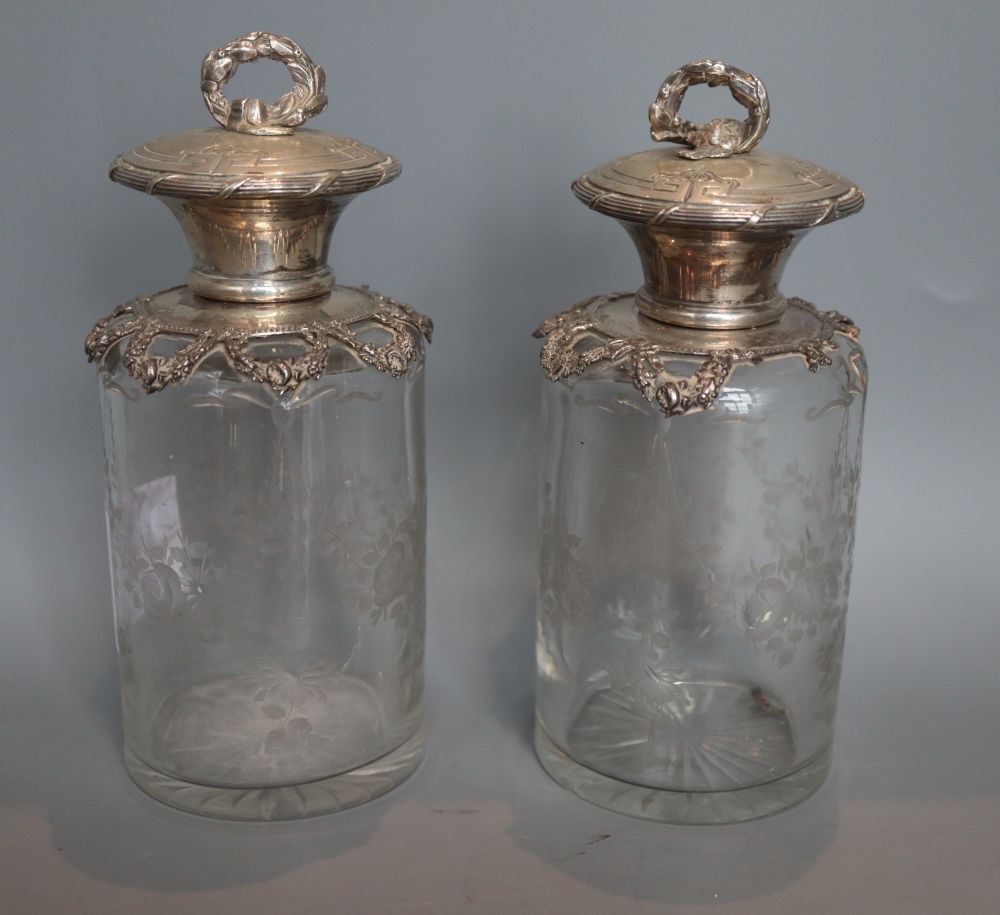 A pair of early 20th century Portuguese white metal mounted etched glass scent jars